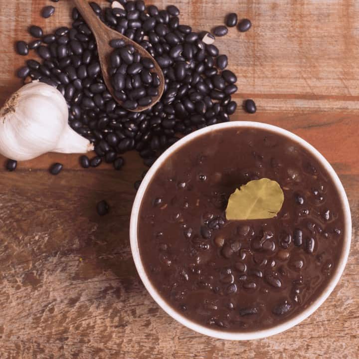 bowl of cooked black beans and ingredients