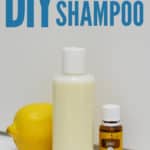 bottle of diy shampoo with whole lemon and bottle of lemon essential oil with title text "DIY Clarifying Shampoo"