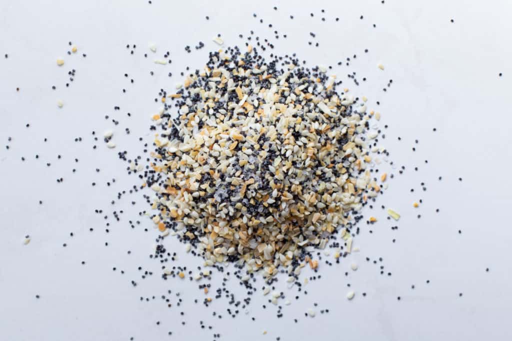 everything bagel seasoning ingredients on a white background