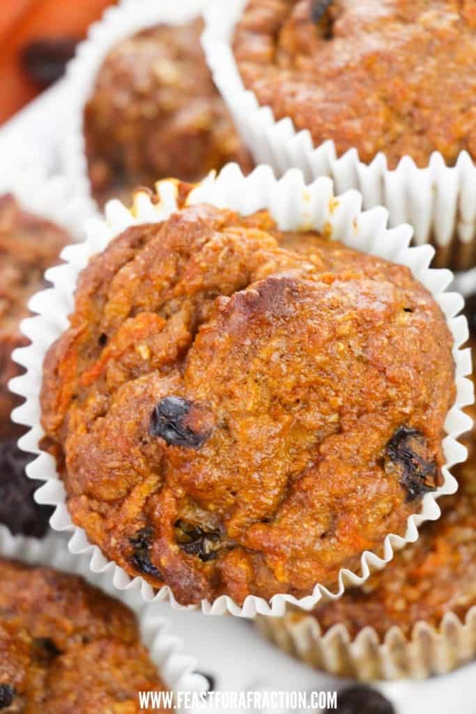 close up view of morning glory muffins stacked on white platter