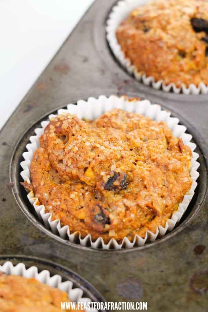 baked apple carrot muffins in muffin pan