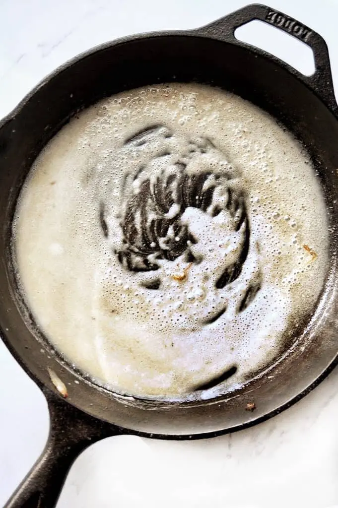 butter and flour cooking in cast iron skillet