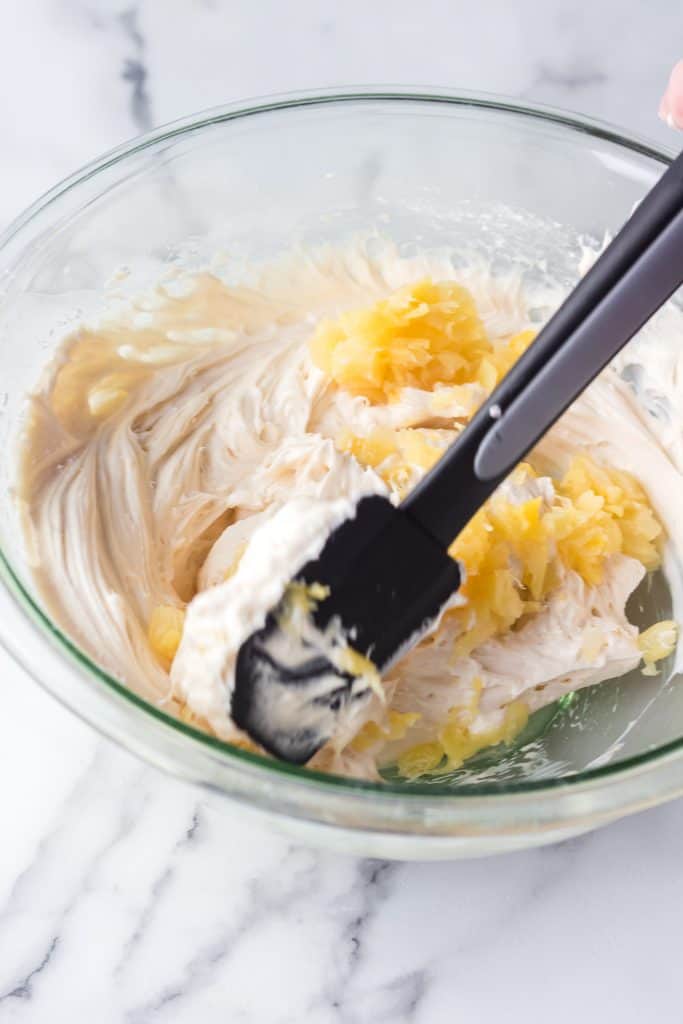 pineapple cream cheese icing in glass bowl