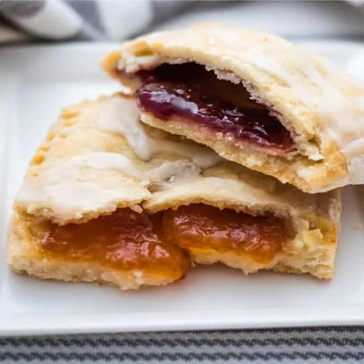 toaster pastries filled with apricot and raspberry jam on white plate