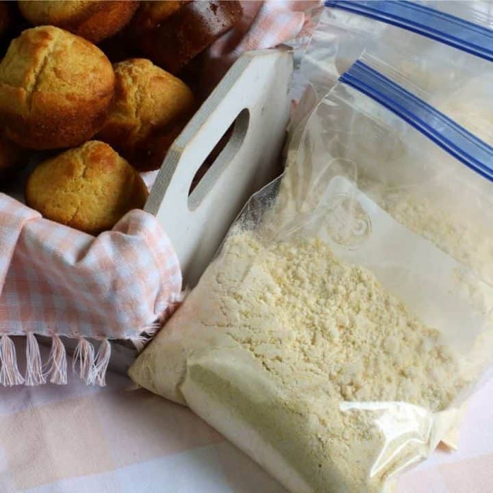 square image of cornbread mix in plastic storage bags and white basket of corn muffins