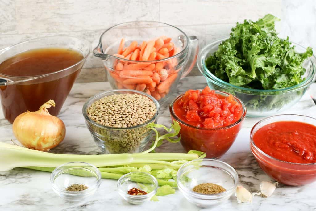 instant pot lentil soup ingredients on marble counter