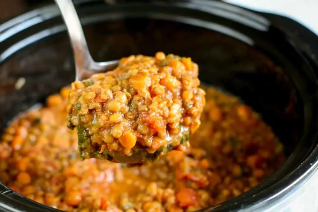 ladle filled with instant pot lentil soup