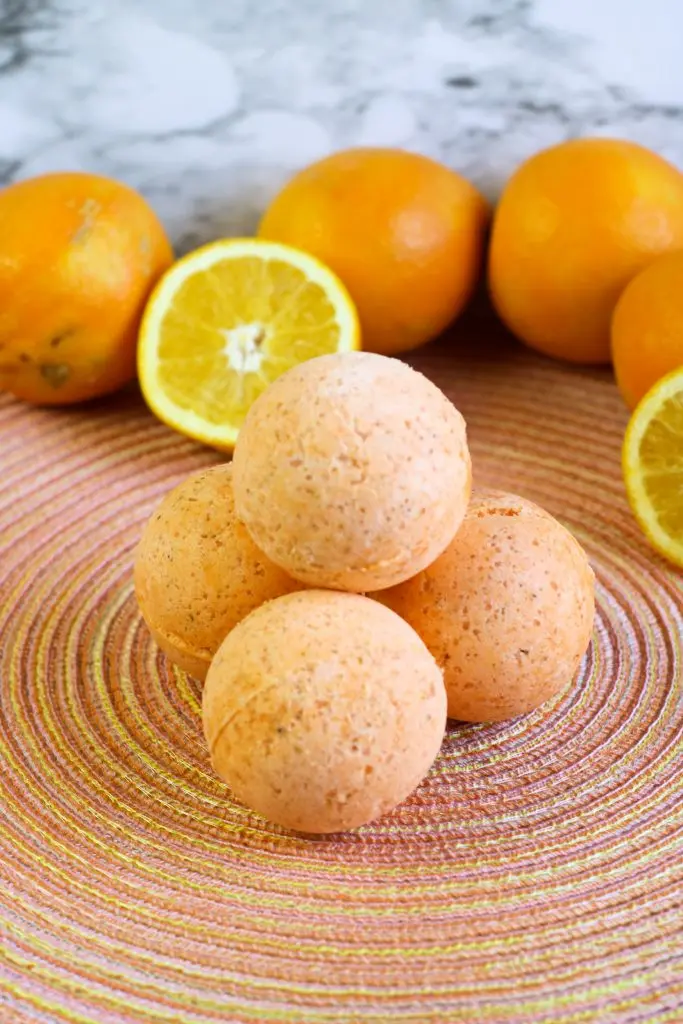 diy bath bombs and oranges on colorful placemat