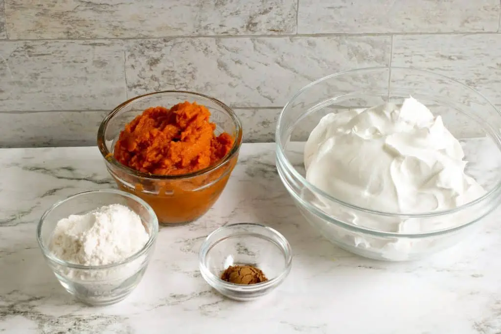 pumpkin puree, instant vanilla pudding, cool whip and pumpkin pie spice in glass bowls