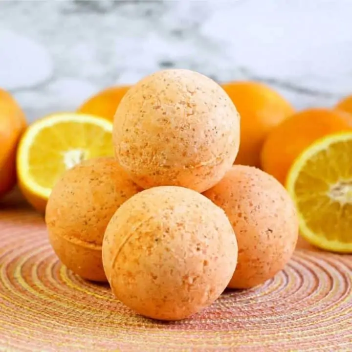square image of diy bath bombs with whole and sliced oranges
