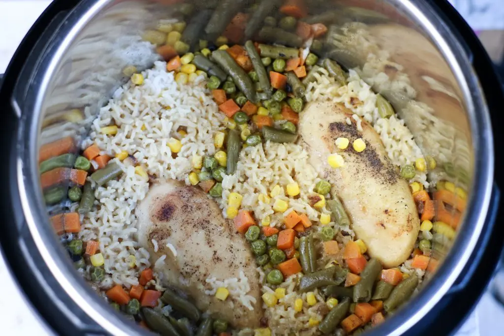 overhead of instant pot chicken and rice in pot