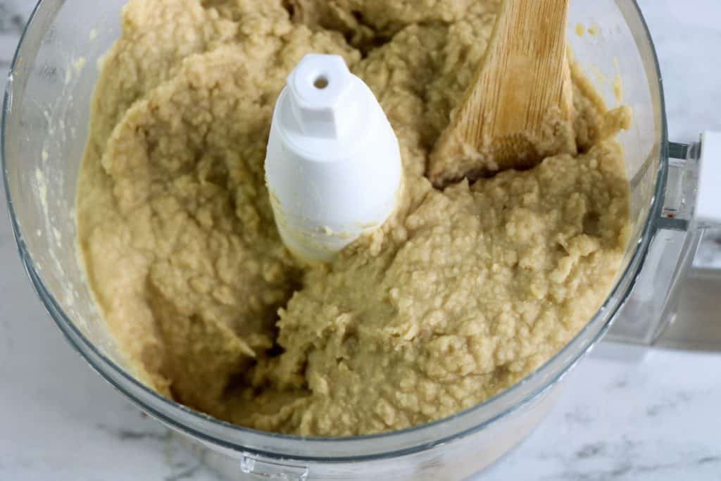 close up of blended chickpeas in food processor