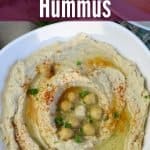 hummus in white bowl with title text "Instant Pot Hummus)