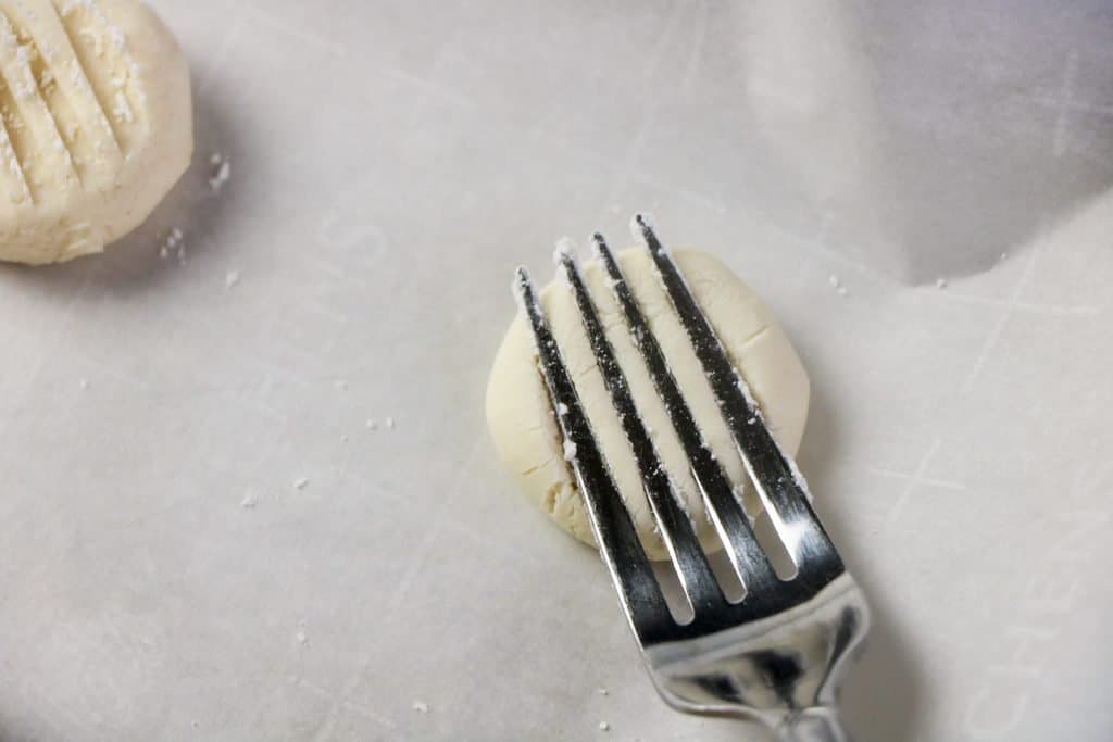 fork pressed on cookie dough