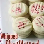 whipped shortbread cookies stacked on white platter with title text