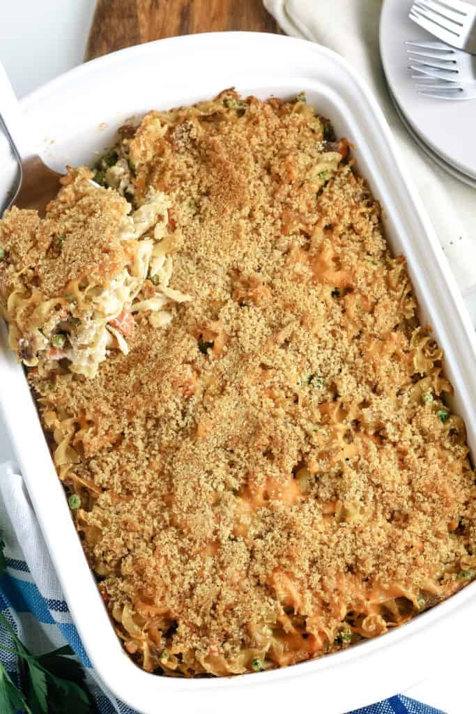 overhead image of baked tuna noodle casserole in white baking dish