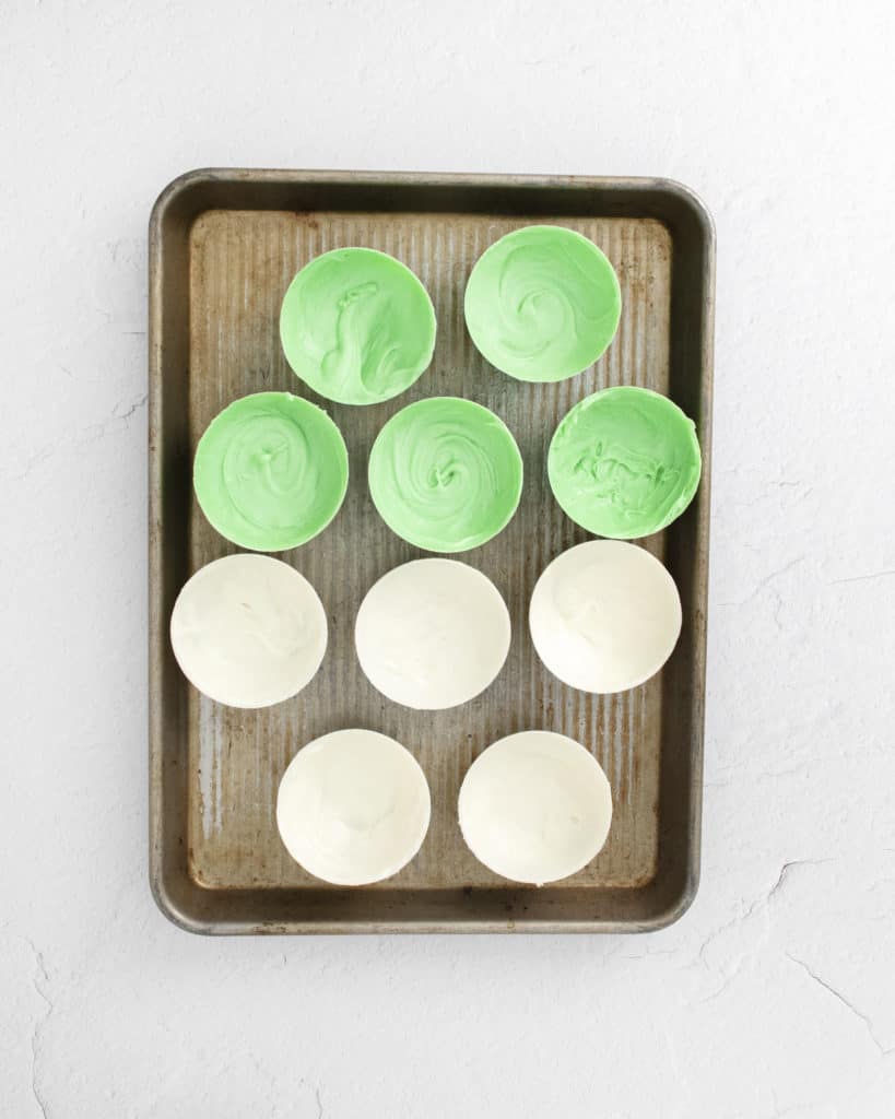 green and white chocolate shells on sheet pan