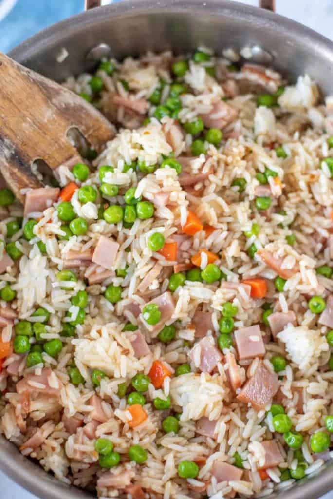 teriyaki ham stir fry in pan with wooden spoon