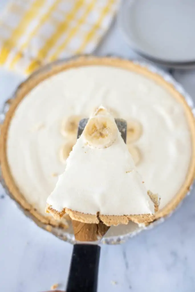 slice of banana pudding pie on metal spatula