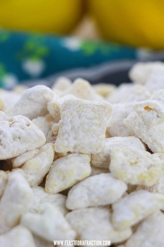 close up of prepared lemon puppy chow with lemons in background