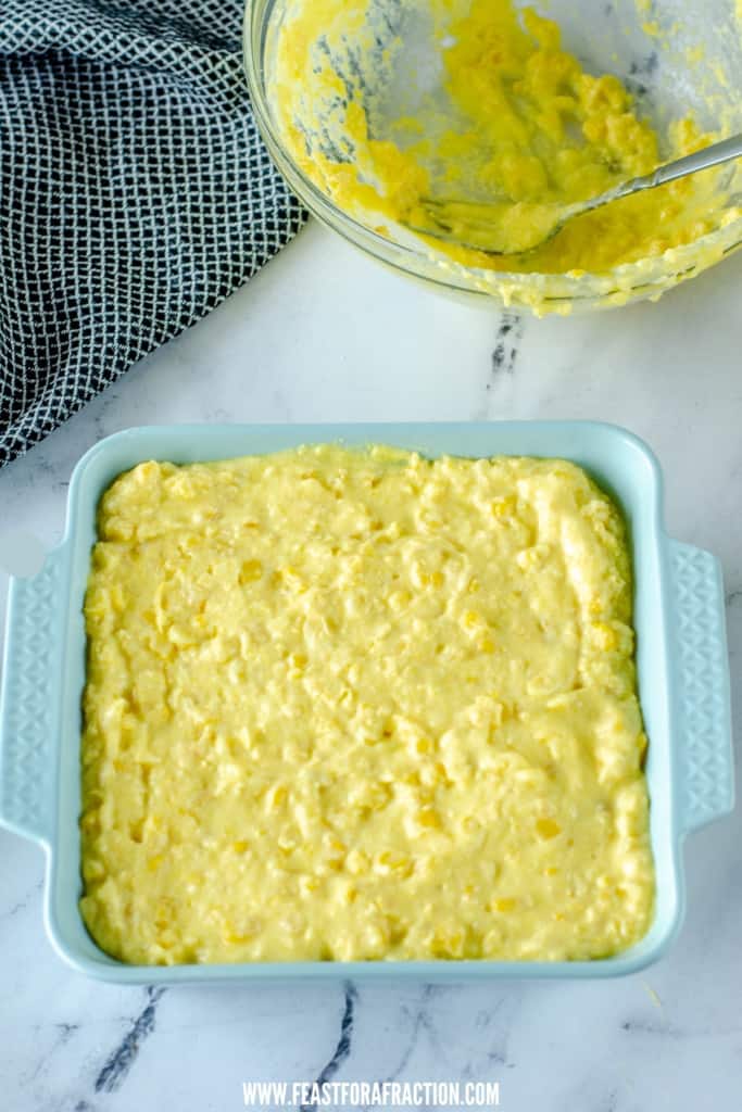 corn casserole ingredients mixed and poured into baking dish