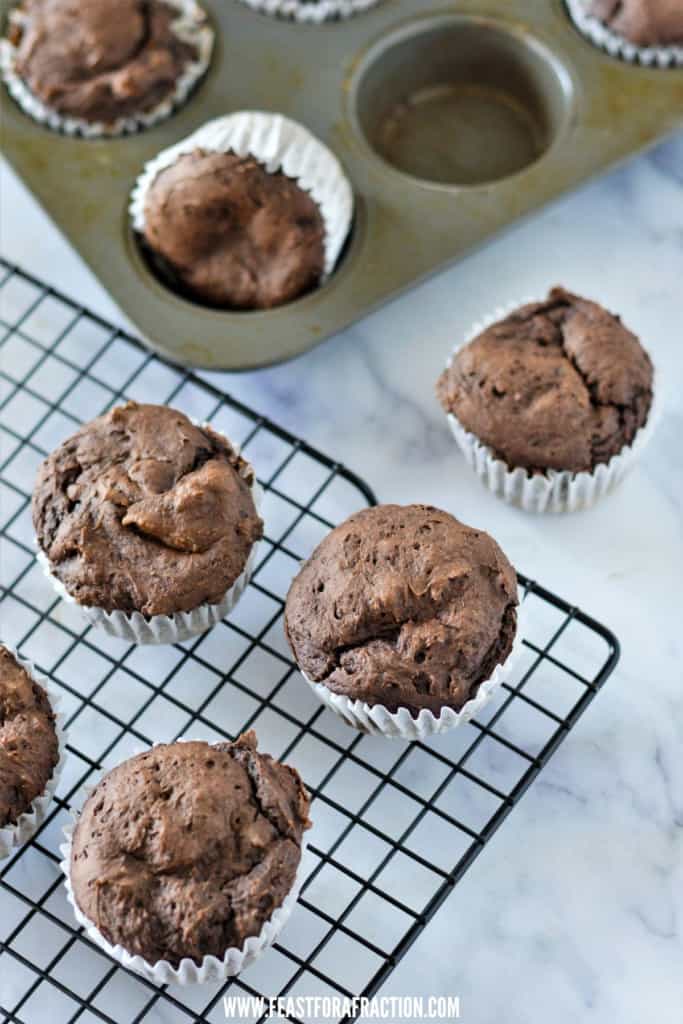baked chocolate pumpkin muffins on cooling rack