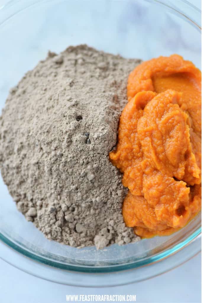 chocolate cake mix and pumpkin puree in glass mixing bowl