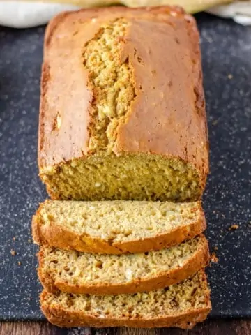 applesauce banana bread sliced on cutting board