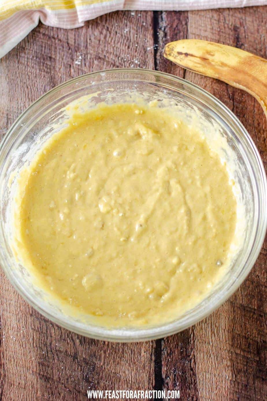 applesauce banana bread batter in glass bowl