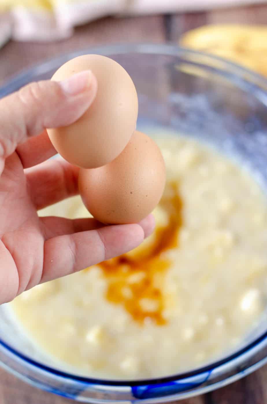 whole eggs ready to add to wet ingredients for applesauce banana bread