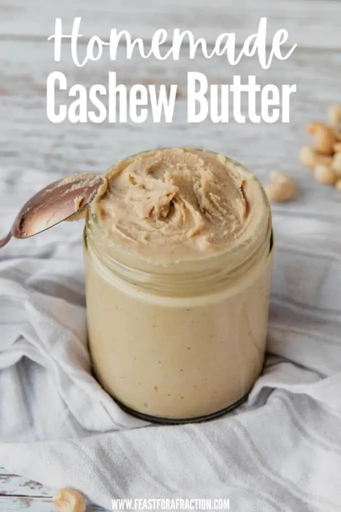 jar of homemade cashew butter on cloth napkin with spoon leaning against jar and title text