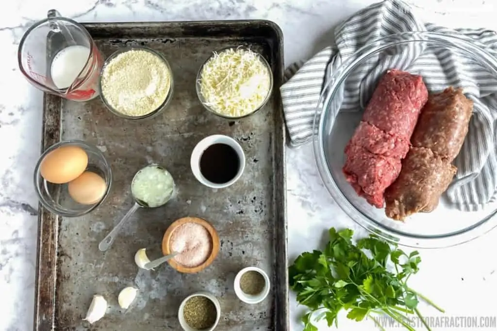 meatball ingredients on sheet pan and in glass bowl