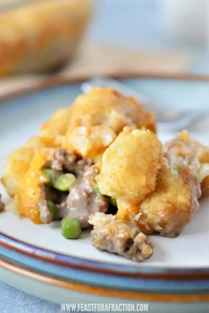 tater tot casserole on plate with fork in background