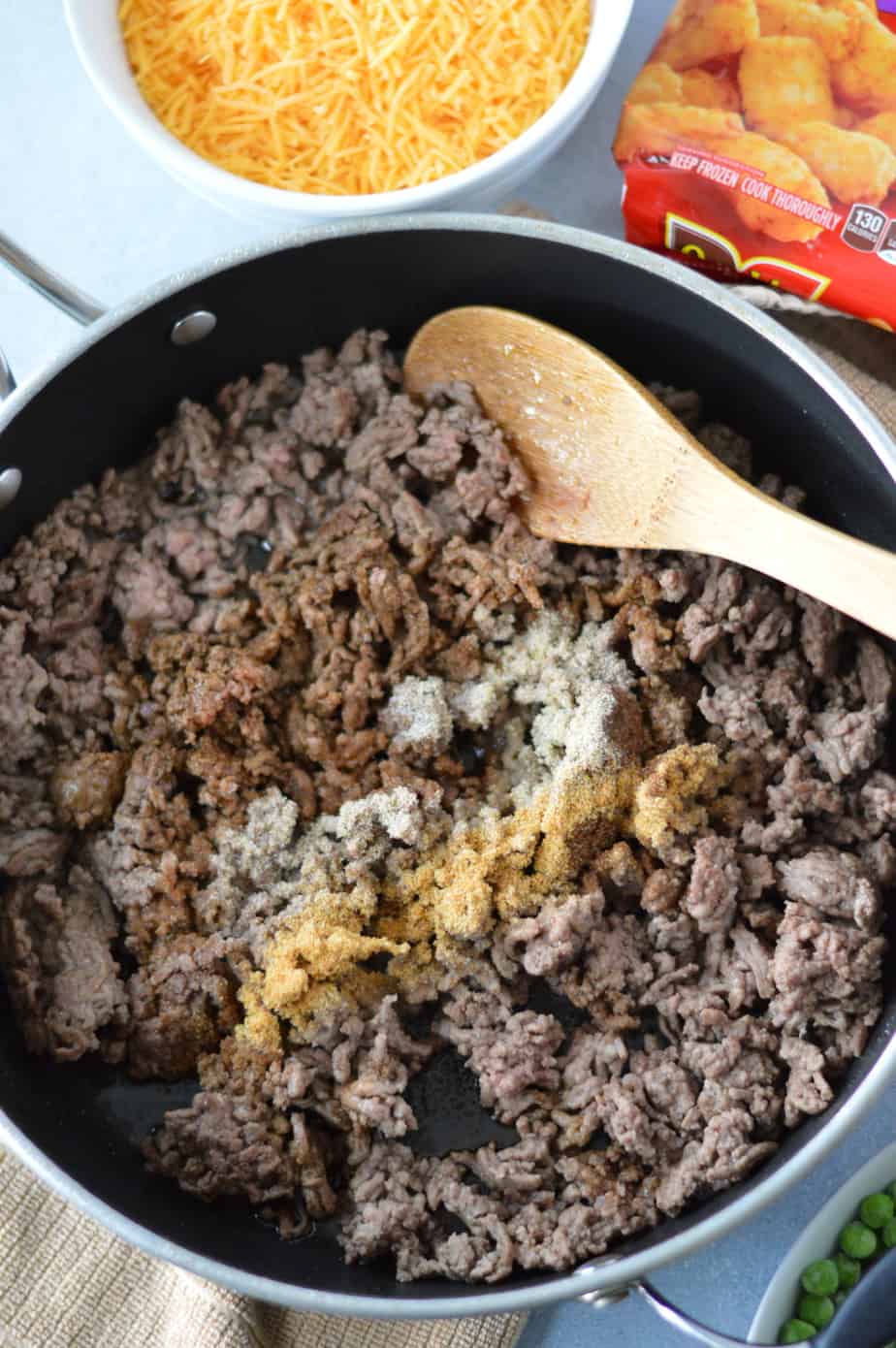 ground beef being browned in pan with seasonings