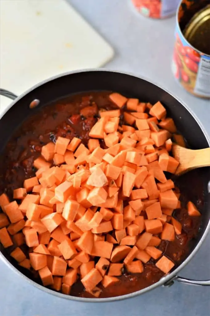 diced sweet potatoes added to a pot of no bean turkey chili