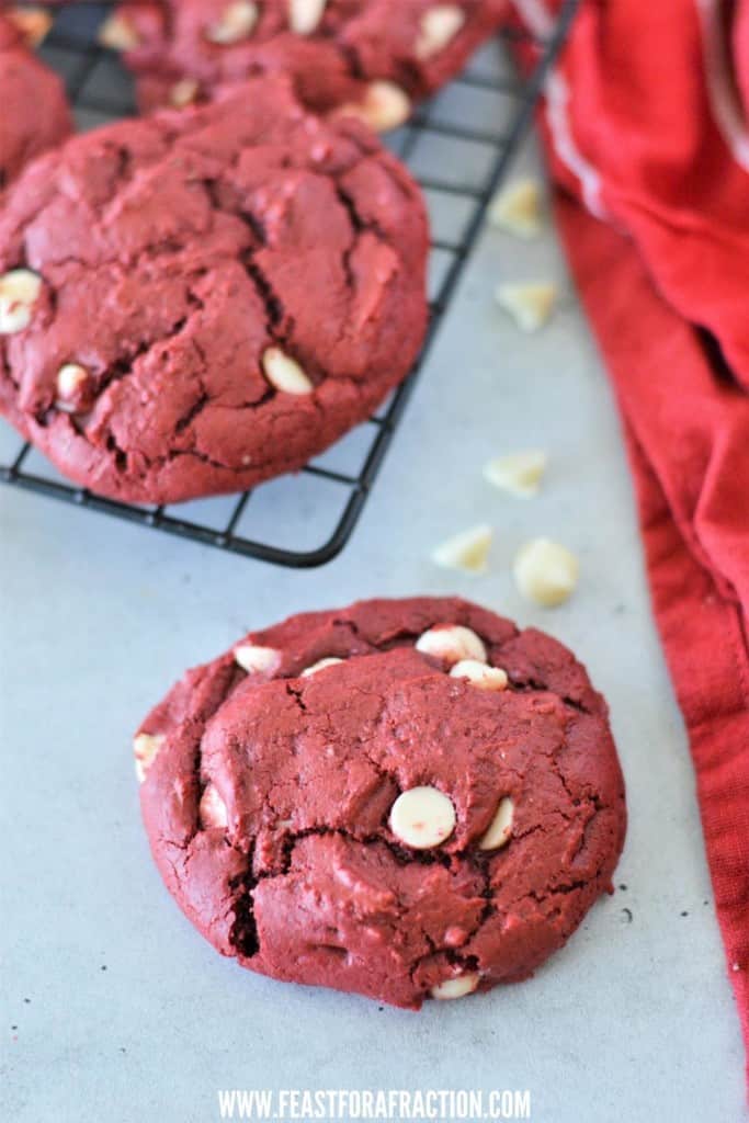 red velvet cake mix cookies on cooling rack with red cloth napkin