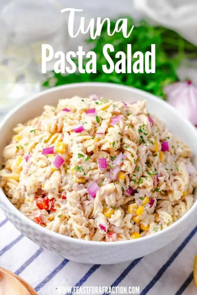 pasta salad with tuna in white bowl with title text