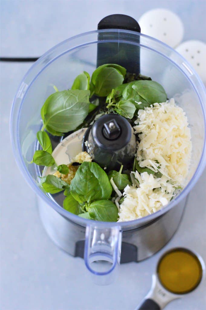 basil leaves, shredded parmesan cheese and minced garlic in food processor