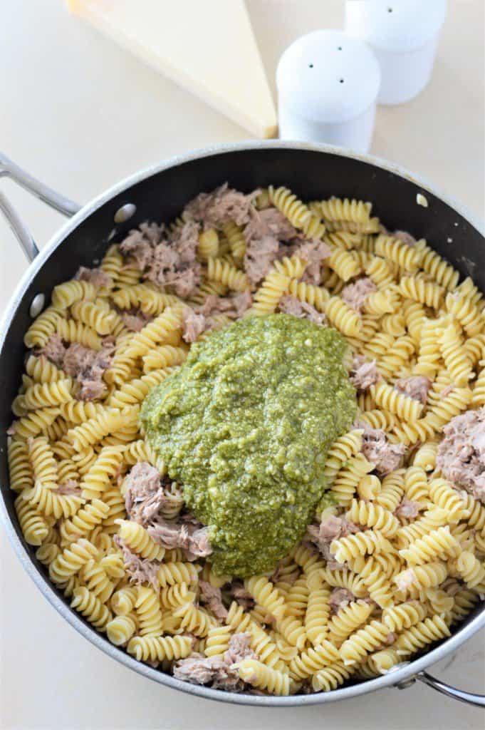 pesto added to pan with tuna and pasta