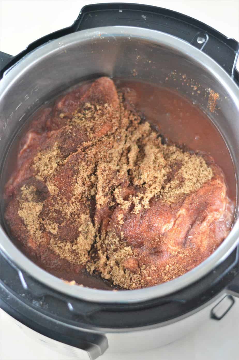 boston butt roast with dry rub and braising liquid in instant pot