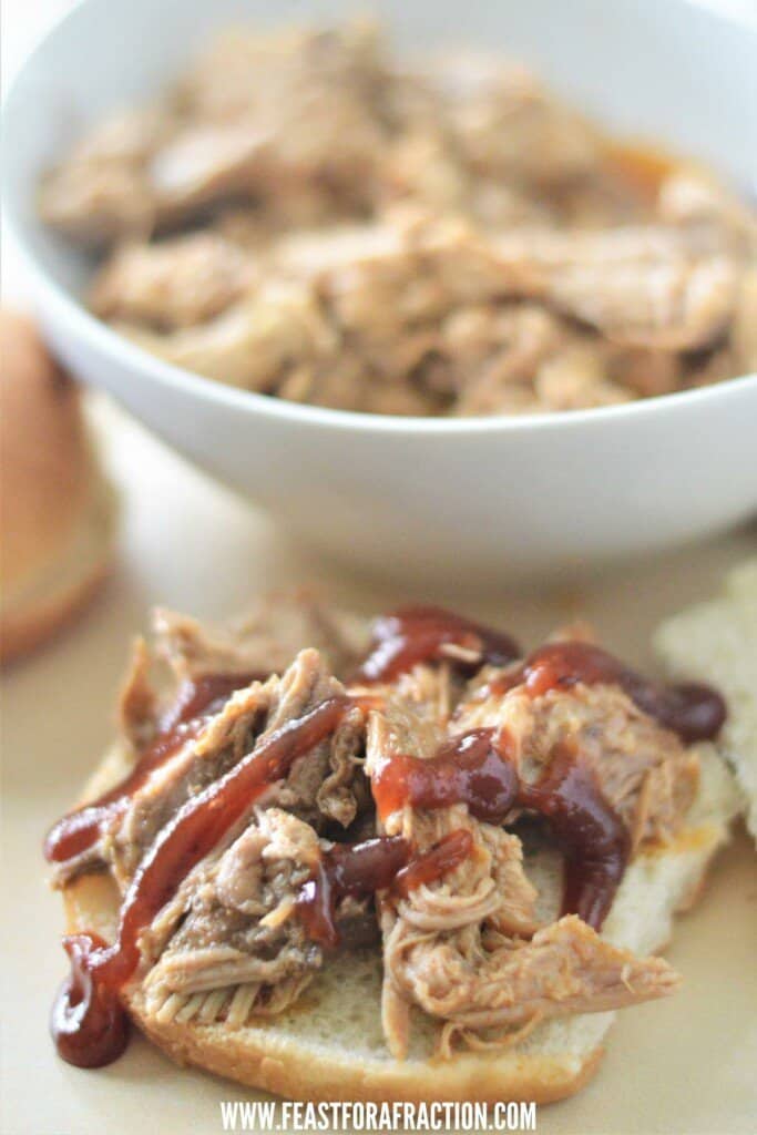 instant pot pulled pork on hamburger bun with bbq sauce