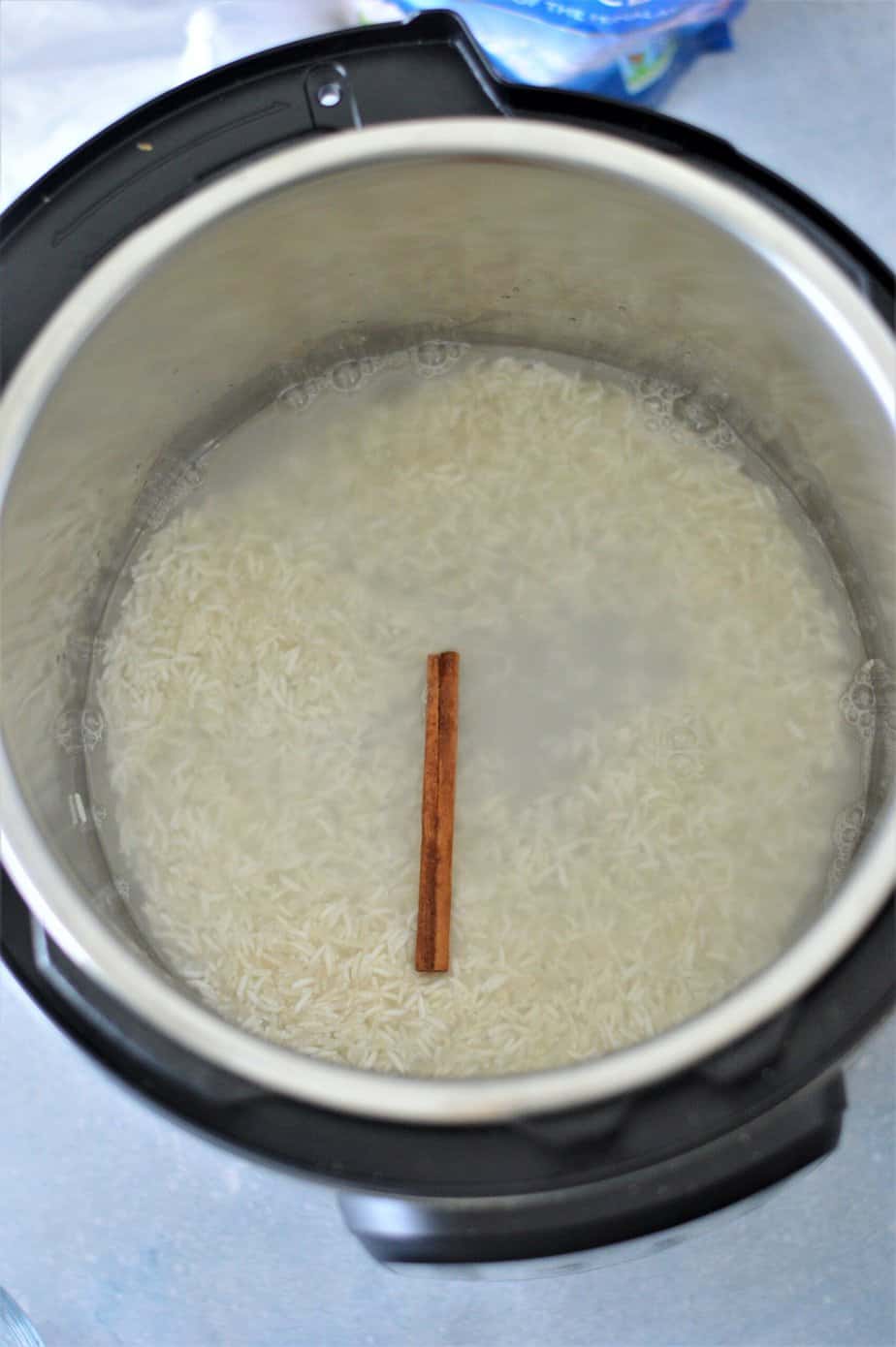 basmati rice, water and cinnamon stick in instant pot