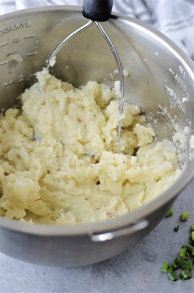 mashed potatoes in metal bowl