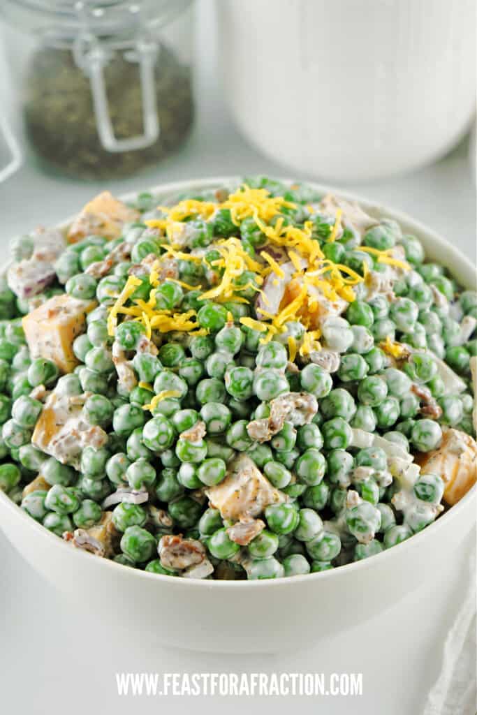 english pea salad in white bowl