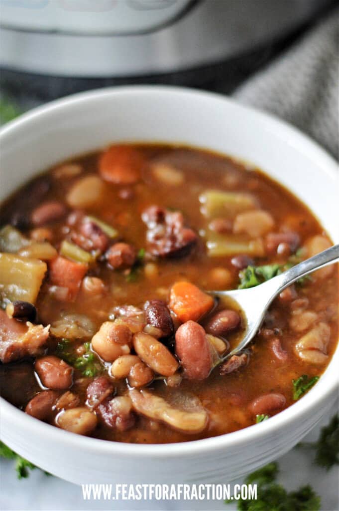 15 bean soup in white bowl with spoon