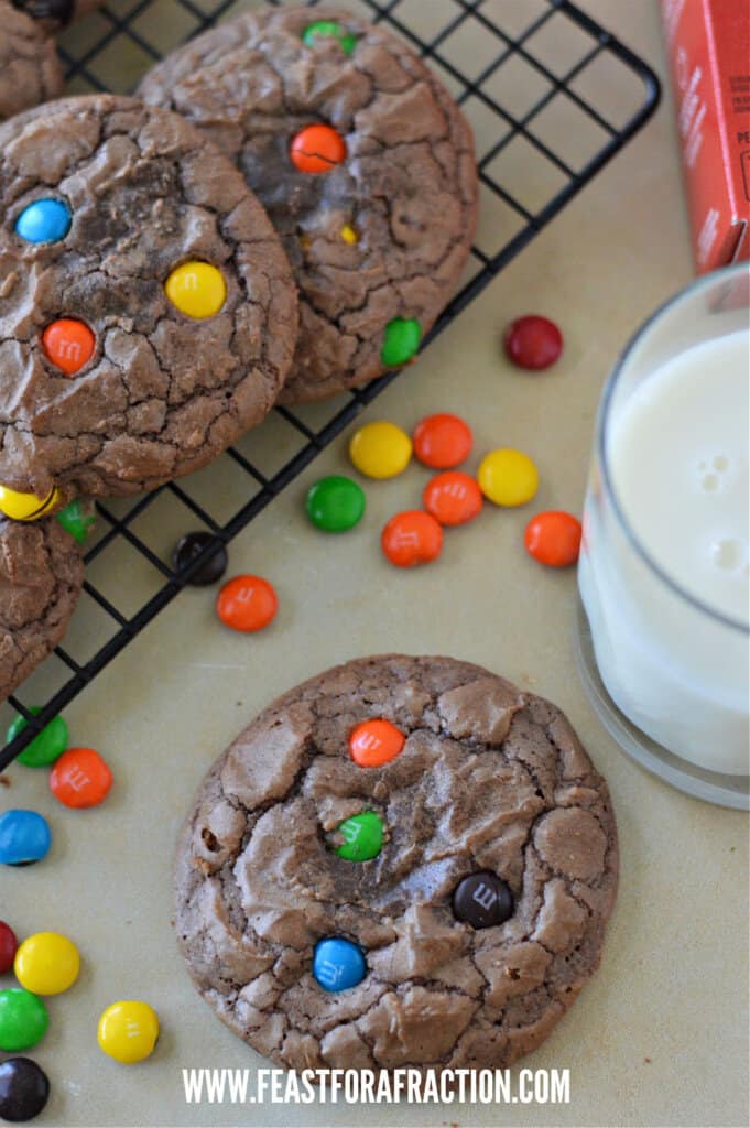 brownie mix cookies on wire rack with glass of milk