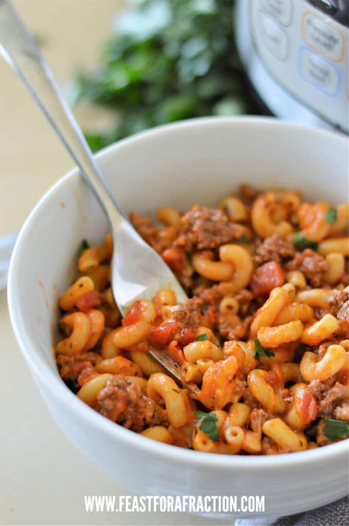 american goulash in white bowl with fork