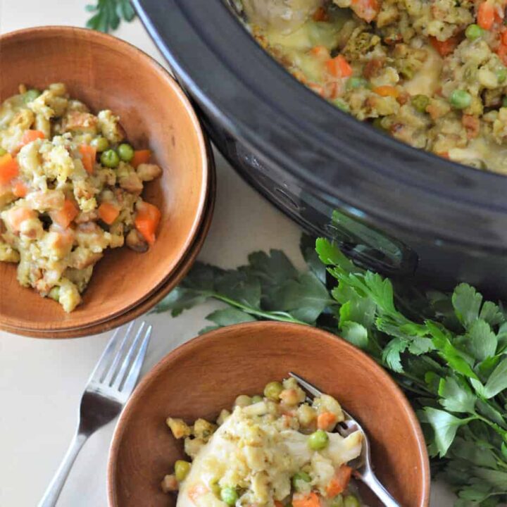 chicken and stuffing in crock pot with bowls