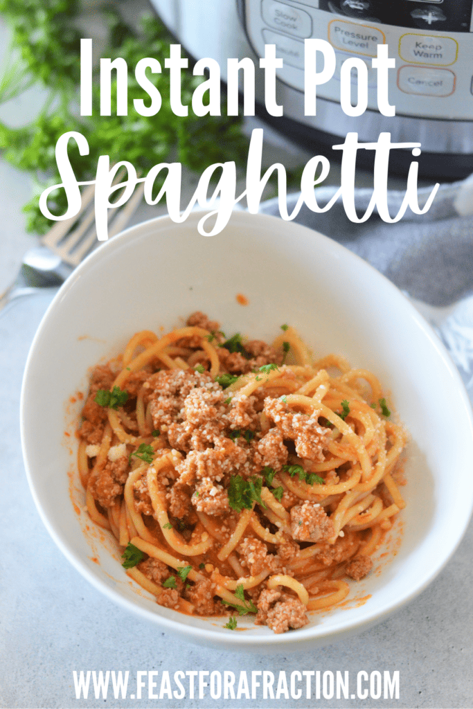 instant pot spaghetti in white bowl with parsley and parmesan cheese