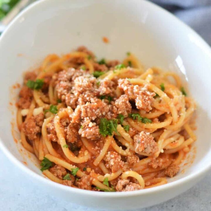 Instant Pot spaghetti with meat sauce and parsley.